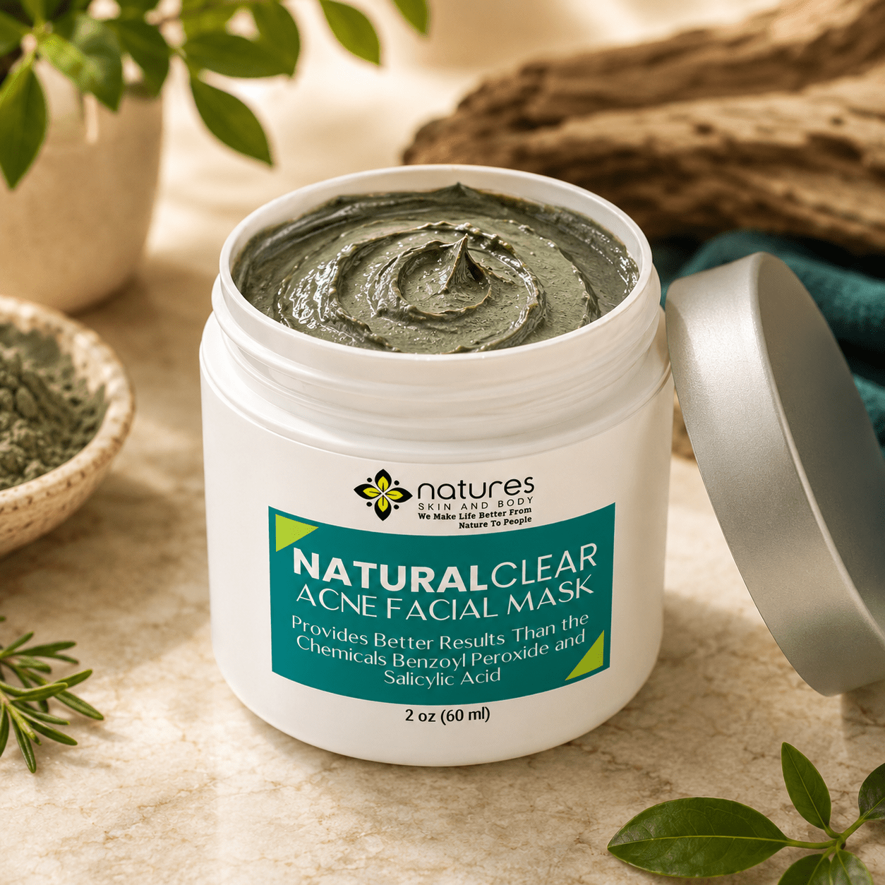 Open jar of green acne facial mask with swirled texture surrounded by natural ingredients and wooden elements